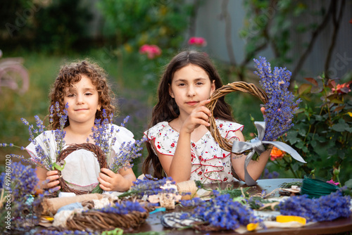 Girls make homemade lavender wreaths as a decor
