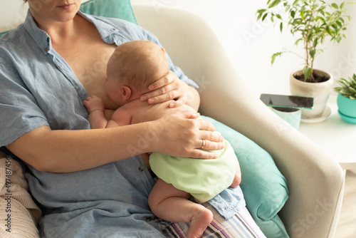 Mothed and baby, breastfeeding in laid back position