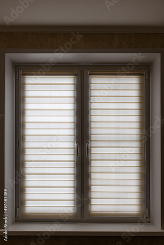 window closed role shutters light yellow striped