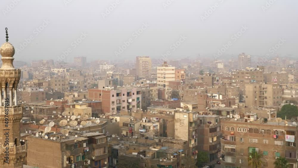 Urban panorama of Cairo. Top view of buildings, houses, trees of arab city. Cityscape of tourist centre located in Egypt. Townscape, residential district. Movement from right to left Urban panorama of Cairo. Top view of buildings, houses, trees of arab city. Cityscape of tourist centre located in Egypt. Townscape, residential district. Movement from right to left
