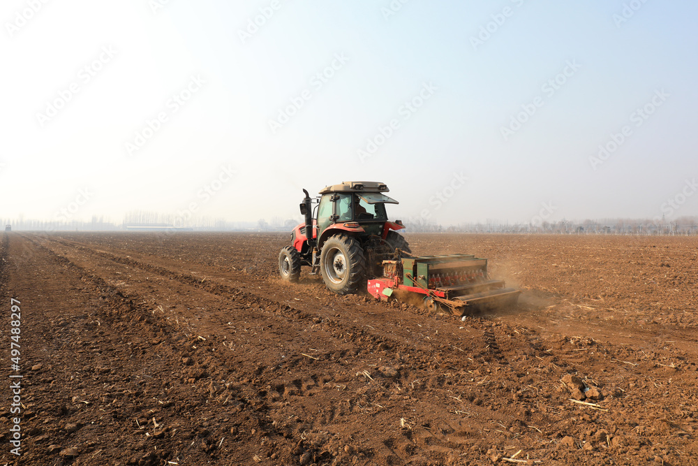 Farmers drive planters to plant peas in the fields, North China Farmers drive planters to plant peas in the fields, North China