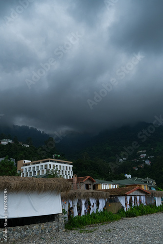 dark clouds over mountains and province. scenic nature view