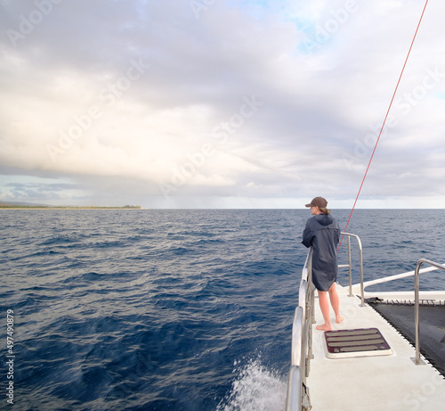 Woman at the bow of a catamaran  © Marcus