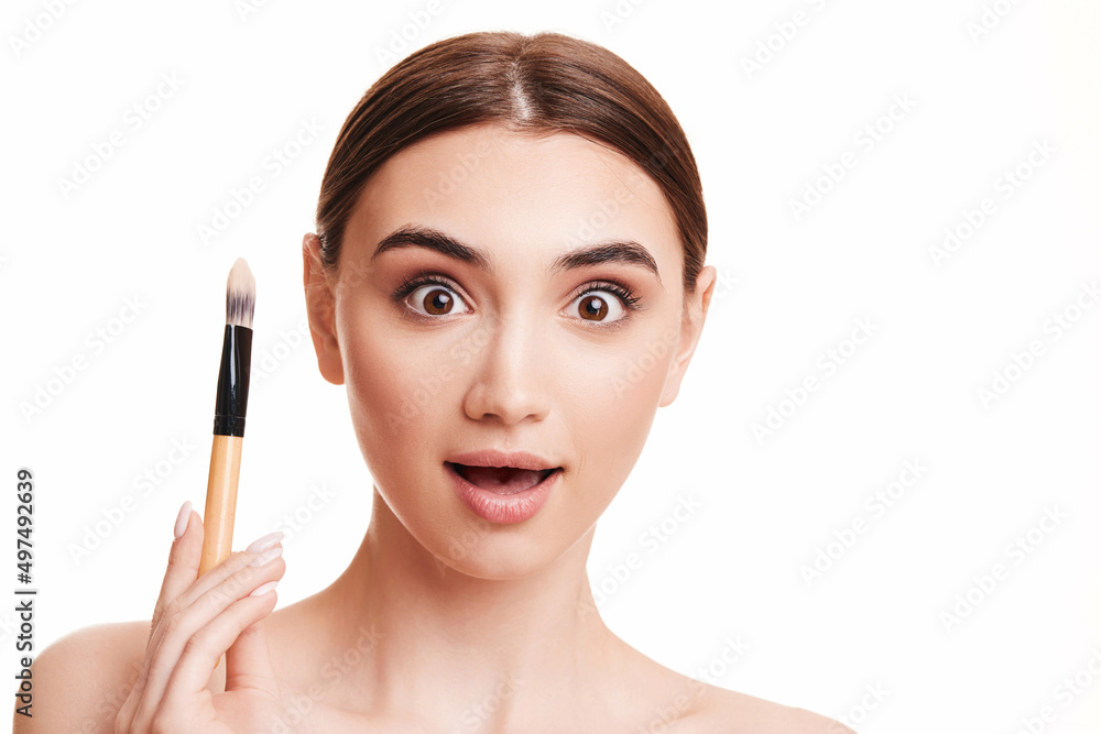 young beautiful woman with make-up brush for powder young beautiful woman with make-up brush for powder