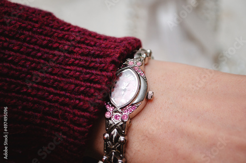 Fashionable women's watches on fragile hands. Tenderness and femininity.