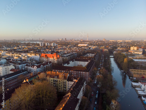 Drone aerial view of Hamburg during sunrise. The skyline of Hamburg over the buildings and canals can be seen on a sunrise time.