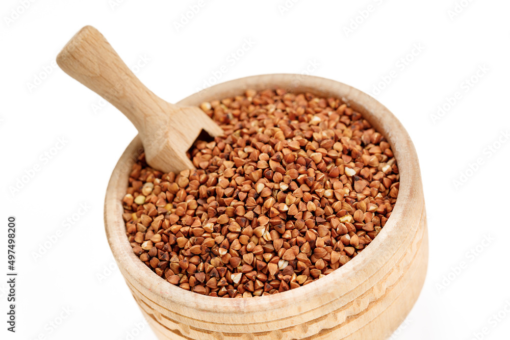 Buckwheat groats in bowls and bags isolated on a white background. High quality photo Buckwheat groats in bowls and bags isolated on a white background. High quality photo