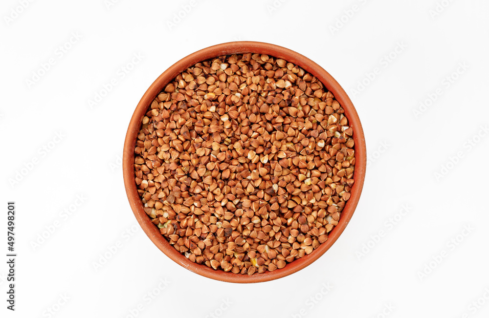 Buckwheat groats in bowls and bags isolated on a white background. High quality photo Buckwheat groats in bowls and bags isolated on a white background. High quality photo