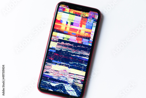 smartphone, mobile phone closeup. Glitches, distorted, corrupted image with colorful lines on the phone. Color channels effect.
