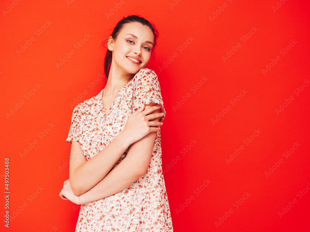 Young beautiful smiling female in trendy summer dress. Sexy carefree blond woman posing near red wall in studio. Positive model having fun. Cheerful and happy. isolated Young beautiful smiling female in trendy summer dress. Sexy carefree blond woman posing near red wall in studio. Positive model having fun. Cheerful and happy. isolated