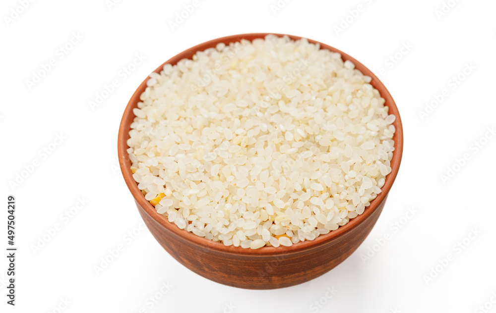 Polished round rice in bowls and bags isolated on a white background. High quality photo Polished round rice in bowls and bags isolated on a white background. High quality photo