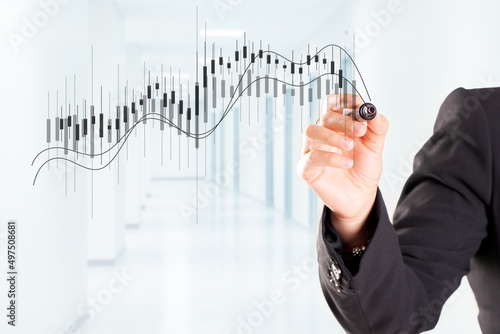 A woman hand drawing Business Growth Graph
