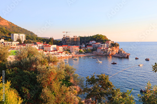 Picturesque coast in the area between Budva and Sveti Stefan at sunset in Montenegro