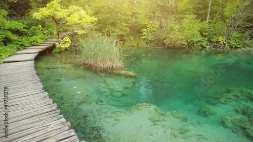 walking on the jetty on Milino Jezero lake. Plitvice Lakes National Park in Croatia in the Lika region. UNESCO World Heritage of Croatia named Plitvicka Jezera. photo