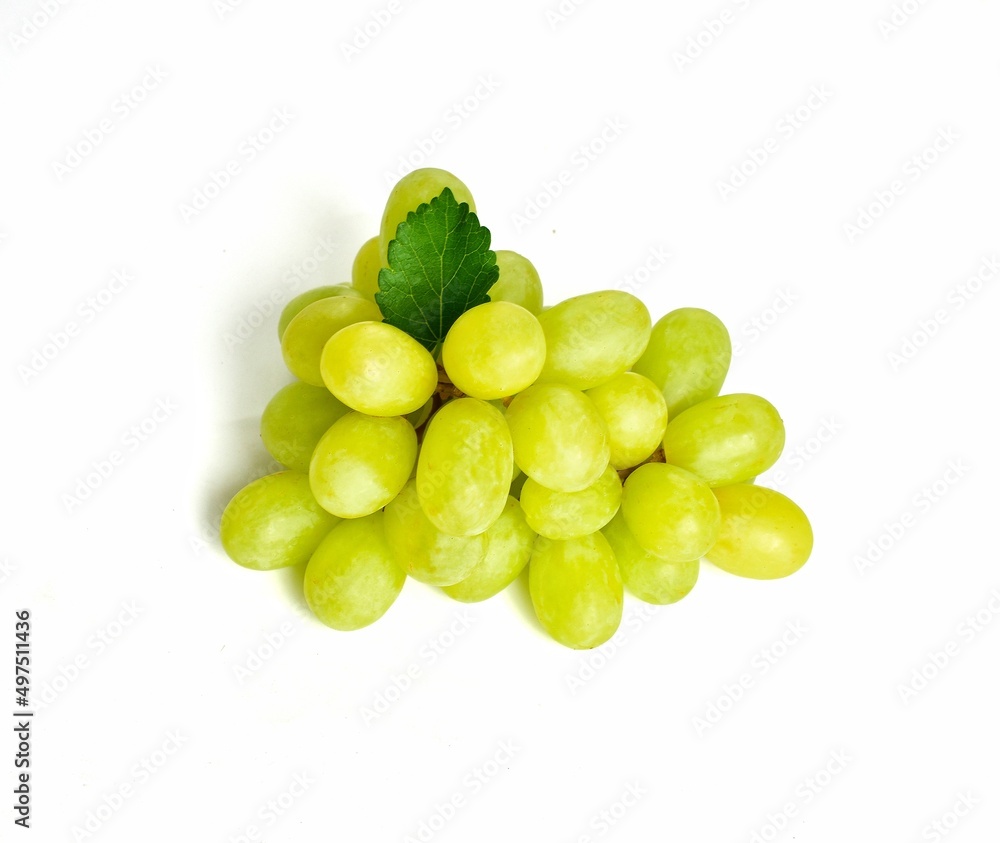 big bunch of green grapes with green grape leaves on white background