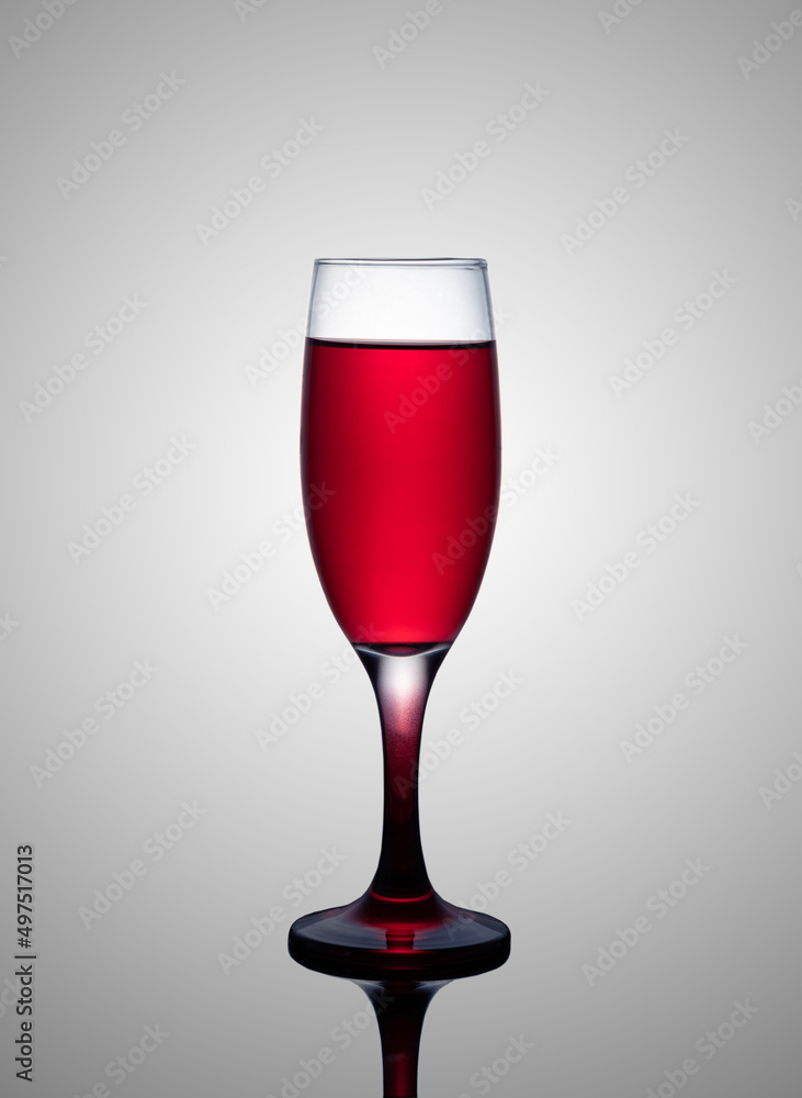 a glass of red wine on a gray gradient background, alcoholic beverage a glass of red wine on a gray gradient background, alcoholic beverage