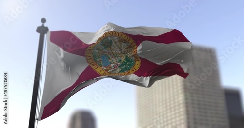 Florida state waving flag on blurry background, USA state news illustration. Blurry background