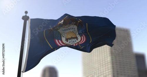 Utah state waving flag on blurry background, USA state news illustration. Blurry background