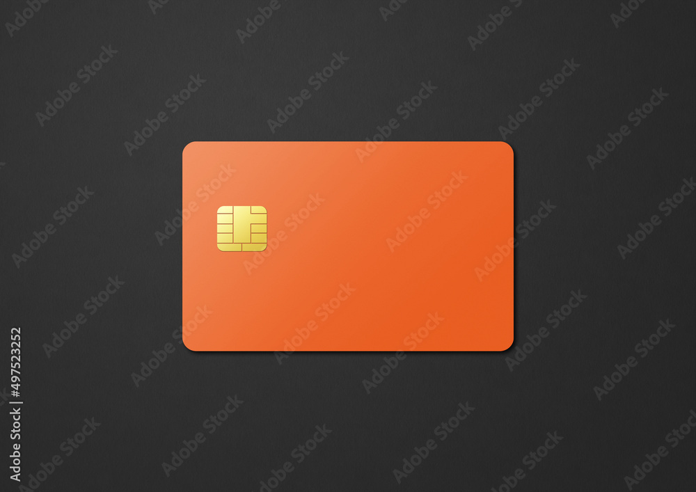 Orange credit card on a black background Orange credit card on a black background
