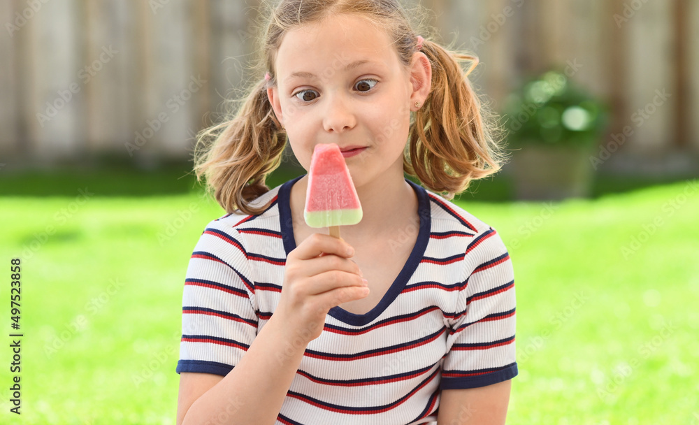 Cute girl eating ice-cream in park Cute girl eating ice-cream in park