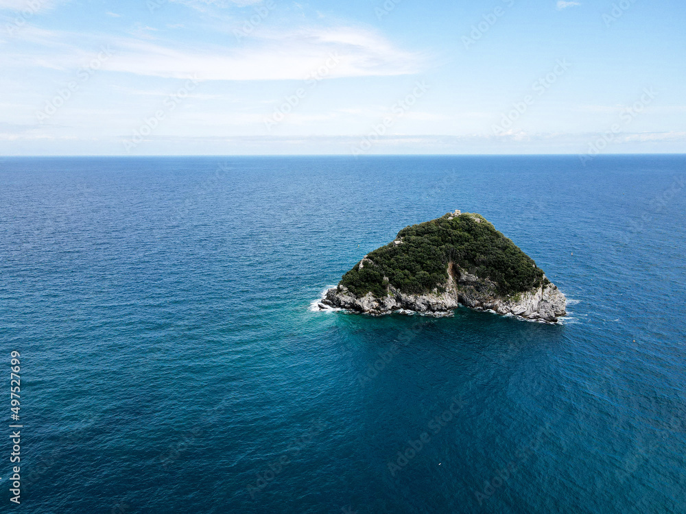 Aerial view of Bergeggi island, heart island from above, in Liguria, north Italy. Drone photography of the Ligurian coast, province of Savona with Spotorno and the island of Bergeggi. Aerial view of Bergeggi island, heart island from above, in Liguria, north Italy. Drone photography of the Ligurian coast, province of Savona with Spotorno and the island of Bergeggi.