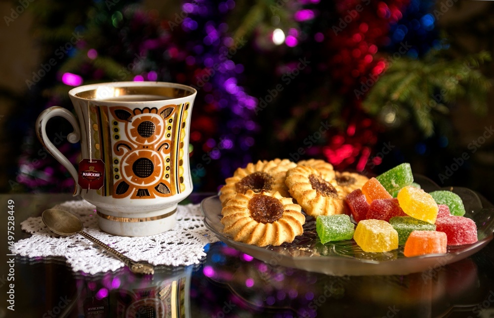 a cup of tea with cookies and sweets