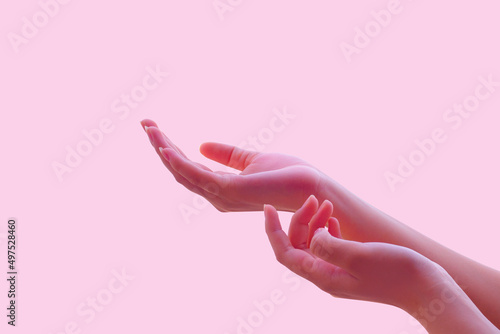 Beautiful woman's hand, good skin, woman's hand with pastel colors