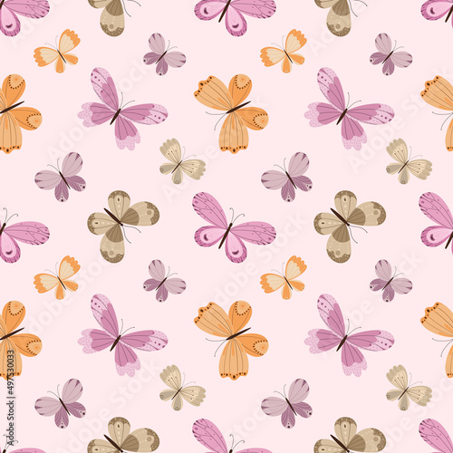 Delicate seamless pattern with a variety of colorful butterflies on a light pink background.