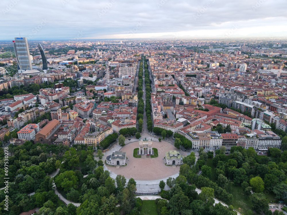 Fototapeta premium Aerial view of Arco della Pace in Milano, north Italy. Drone photography of Arch of Peace in Piazza Sempione, near Sempione park in the heart of Milan, Lombardy and Sforza Castle.