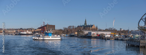 Panorama view with passenger commuting boat, Djurgårdsfärjan, a sunny spring day in Stockholm 