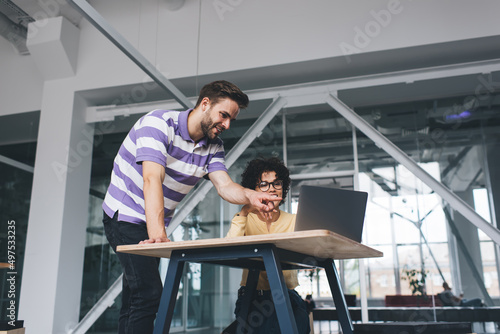 Millenial business man and woman working in office