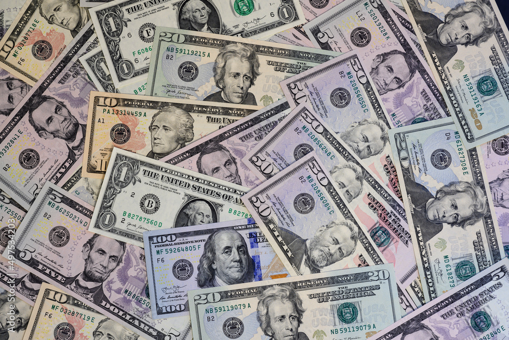 Banknotes of US dollars of different denominations arranged in random order Banknotes of US dollars of different denominations arranged in random order
