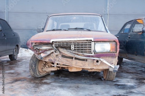 An old Soviet car damaged in a traffic accident.