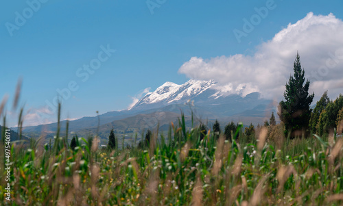 View of the Cayambe volcano from the town of Olmedo in the province of Cayambe during a sunny morning