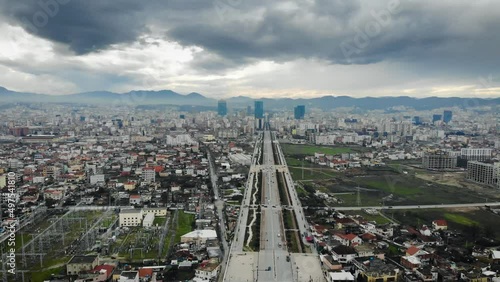 Flying Above the Long Unfinished Boulevard of Tirana, Albania on a cloudy day photo