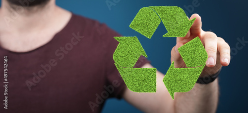 hand holding green recycle ...