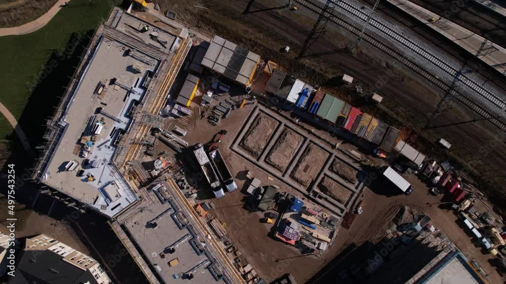 Rotating top down aerial of construction site in Zutphen of real estate investment and social housing market collective building Ubuntuplein project revealing the wider surrounding Rotating top down aerial of construction site in Zutphen of real estate investment and social housing market collective building Ubuntuplein project revealing the wider surrounding