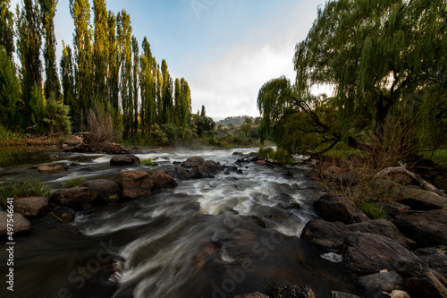 Beautiful shot of the landscape with a long exposure view of a river during sunset in Cooma photo