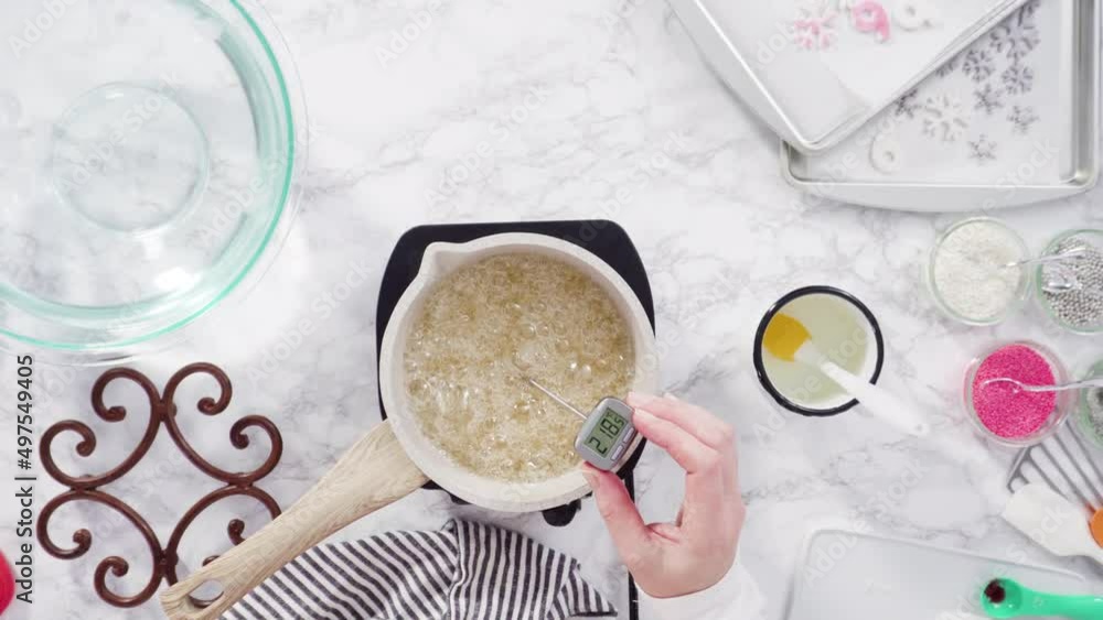 Flat lay. Step by step. Caramelizing sugar in a small cooking pot over the small electric stove. Flat lay. Step by step. Caramelizing sugar in a small cooking pot over the small electric stove.