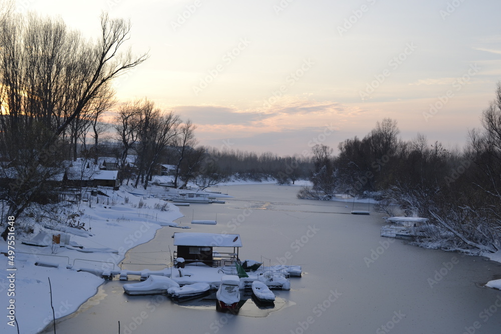 Panorama of a frozen lake and snow-covered trees, in Novi Sad, Serbia. Panorama of a frozen lake and snow-covered trees, in Novi Sad, Serbia.