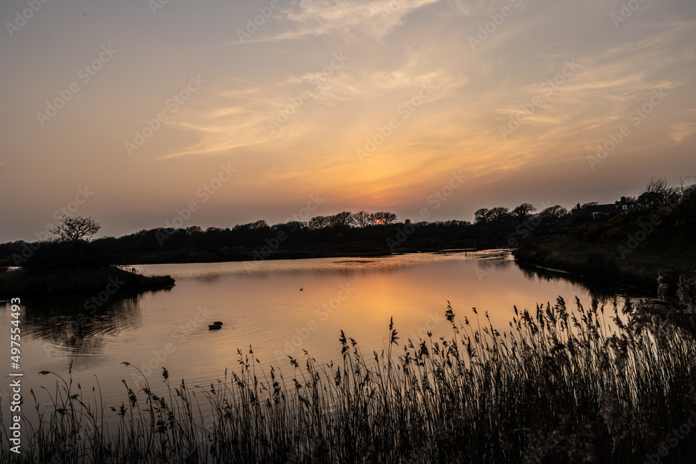 Naklejka premium sunset over lake