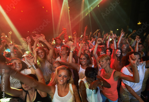 These fans llive to rock. Attractive female fans enjoying a concert- This concert was created for the sole purpose of this photo shoot, featuring 300 models and 3 live bands. All people in this shoot