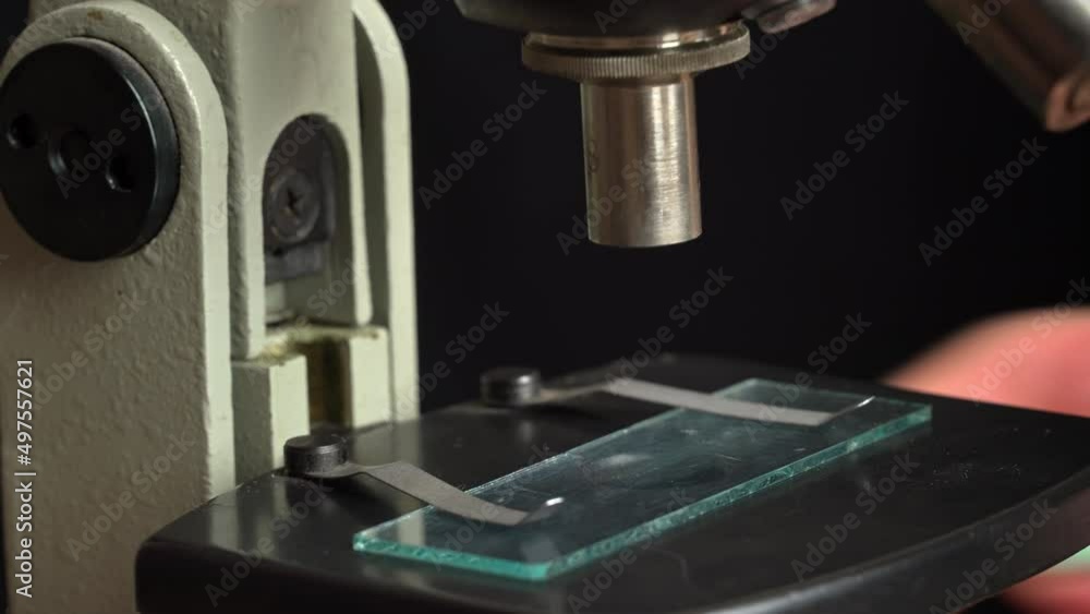 Microscope glass and magnifying glass rise close up. The study of the ...