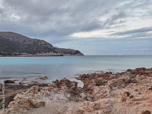 Wallpaper Mural Rocks and turquoise water in Cala Agulla in Cala Ratjada at sunset. Majorca, Balearic Islands, Spain, Europe Torontodigital.ca