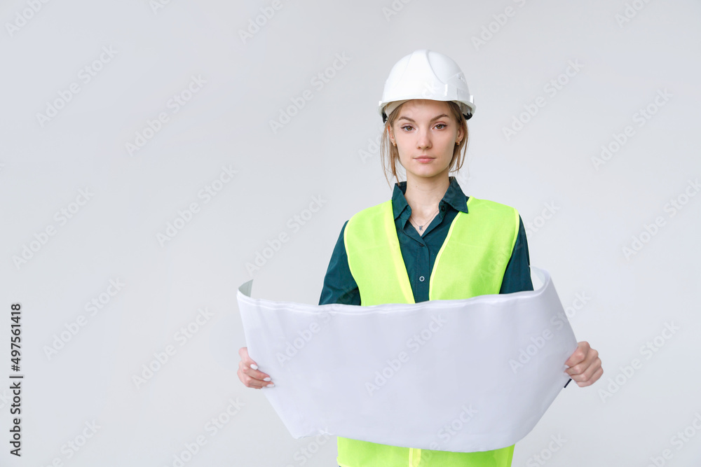 Woman architect in white hard hat with drawings on white background Woman architect in white hard hat with drawings on white background