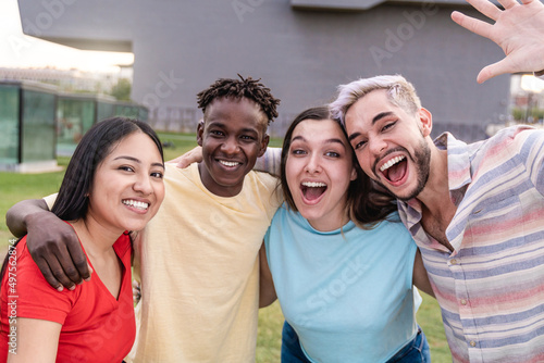 Diverse young people having fun together outdoor - Diversity lifestyle concept - Focus on Asian girl face