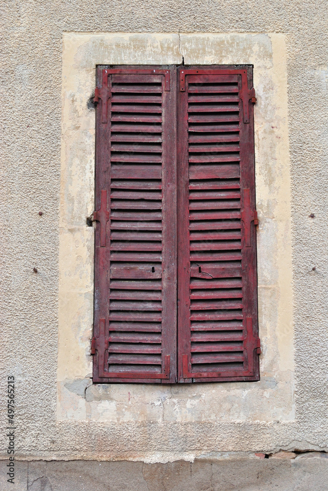 Close Up of Old Closed Wooden Shutters on Window 