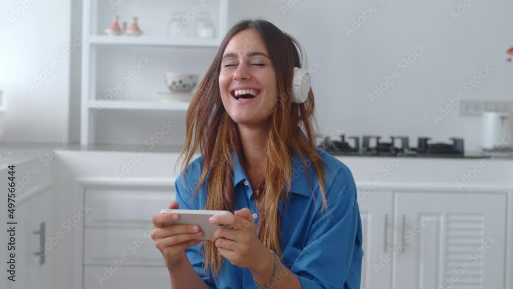 Girl playing video game on mobile phone. Girl playing video game on mobile phone.
