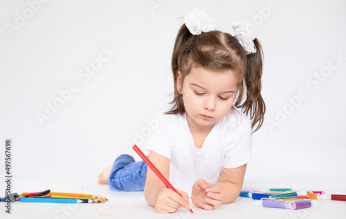 Girl lying on floor and draw white background
