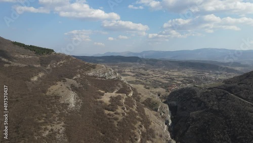 Aerial drone video over the hill mountain cliff with rocks of the Nisevac near Svrljig in Serbia in sunny day  photo